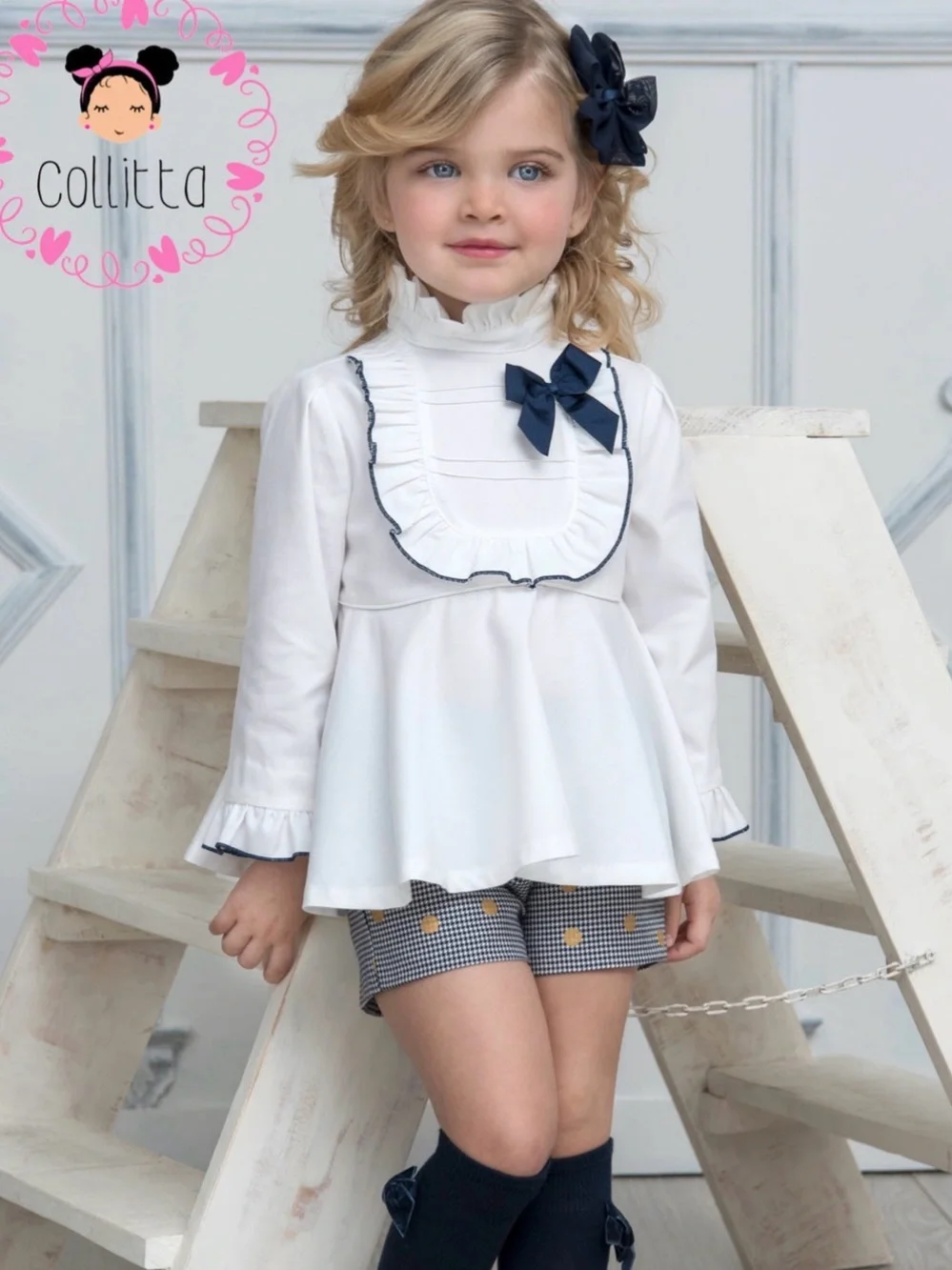 White Ruffle Neck Peplum Top with Navy Bow